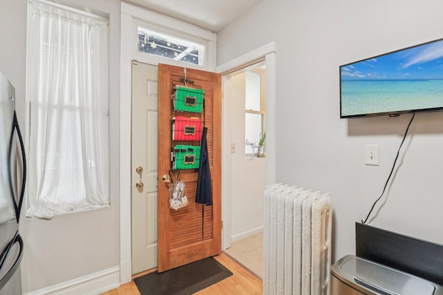 4702 N Campbell Ave Unit 2, Chicago, IL 60625 - entryway with light wood-style floors and baseboards