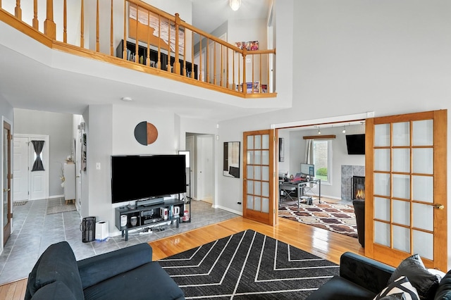 3705 Streamwood Dr, Hazel Crest, IL 60429 - living room featuring french doors, a high ceiling, wood finished floors, and a tile fireplace