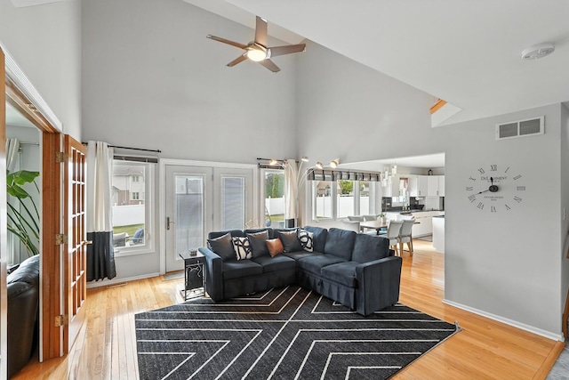 3705 Streamwood Dr, Hazel Crest, IL 60429 - living room featuring high vaulted ceiling, light wood-type flooring, and a ceiling fan