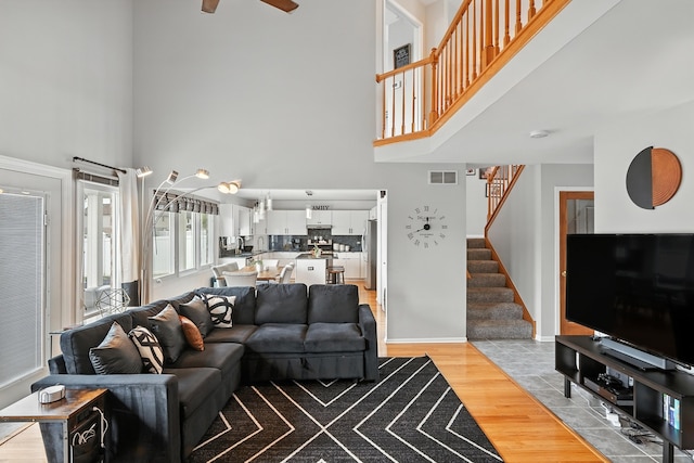 3705 Streamwood Dr, Hazel Crest, IL 60429 - living room with a high ceiling, light wood finished floors, stairway, and ceiling fan