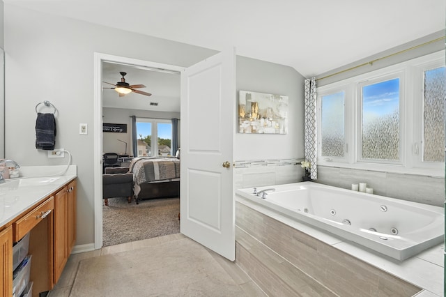 3705 Streamwood Dr, Hazel Crest, IL 60429 - bathroom featuring connected bathroom, a jetted tub, ceiling fan, vanity, and tile patterned floors