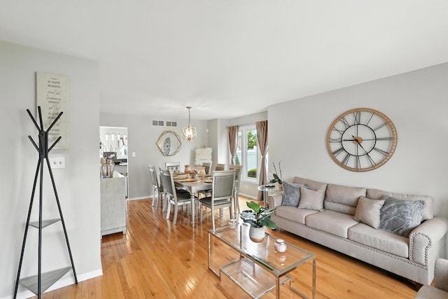 3705 Streamwood Dr, Hazel Crest, IL 60429 - living area featuring a chandelier and light wood-style flooring