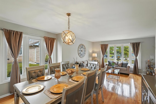 3705 Streamwood Dr, Hazel Crest, IL 60429 - dining space with light wood-style floors and a chandelier