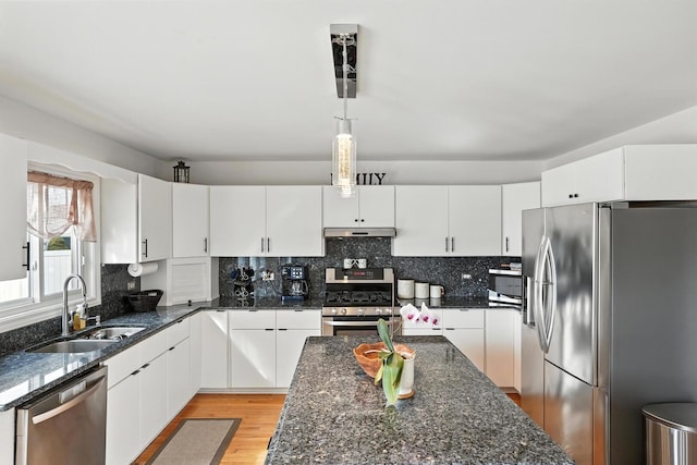3705 Streamwood Dr, Hazel Crest, IL 60429 - kitchen featuring stainless steel appliances, light wood finished floors, decorative backsplash, and white cabinets