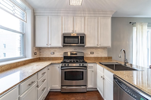 5952 N Paulina St Unit 2N, Chicago, IL 60660 - kitchen featuring stainless steel appliances, white cabinetry, and backsplash