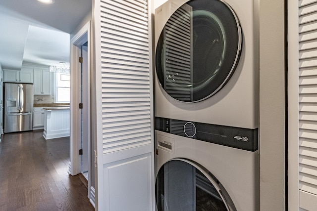 5952 N Paulina St Unit 2N, Chicago, IL 60660 - washroom with stacked washer and clothes dryer, dark wood-type flooring, and recessed lighting