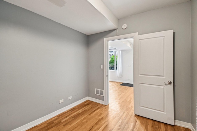 2423 W Augusta Blvd Unit 1, Chicago, IL 60622 - spare room featuring baseboards and light wood-type flooring