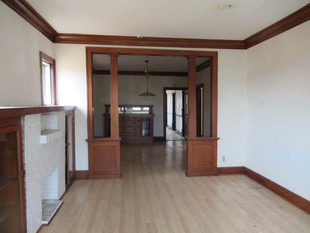 5822 S Sacramento Ave, Chicago, IL 60629 - hallway featuring ornamental molding, light wood-style floors, and decorative columns