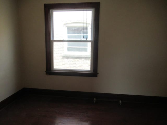 5822 S Sacramento Ave, Chicago, IL 60629 - unfurnished room with plenty of natural light and dark wood finished floors