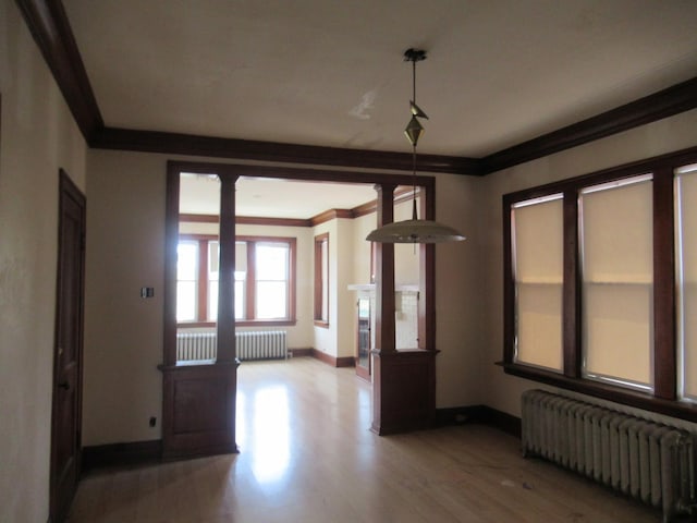 5822 S Sacramento Ave, Chicago, IL 60629 - spare room featuring radiator, crown molding, and wood finished floors