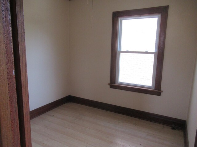 5822 S Sacramento Ave, Chicago, IL 60629 - unfurnished room with light wood-style floors and baseboards