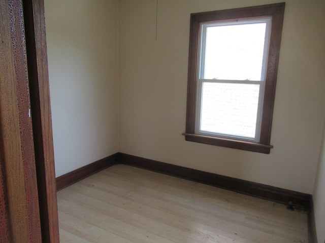 5822 S Sacramento Ave, Chicago, IL 60629 - empty room featuring light wood-style floors and baseboards