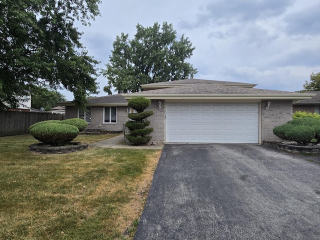 18510 Willow Ln, Lansing, IL 60438 - ranch-style home featuring brick siding, asphalt driveway, and a garage