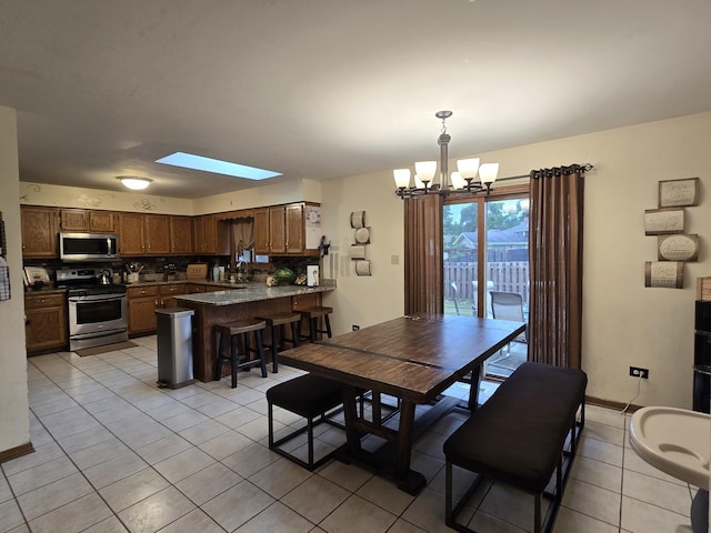 18510 Willow Ln, Lansing, IL 60438 - dining space with a chandelier and light tile patterned flooring