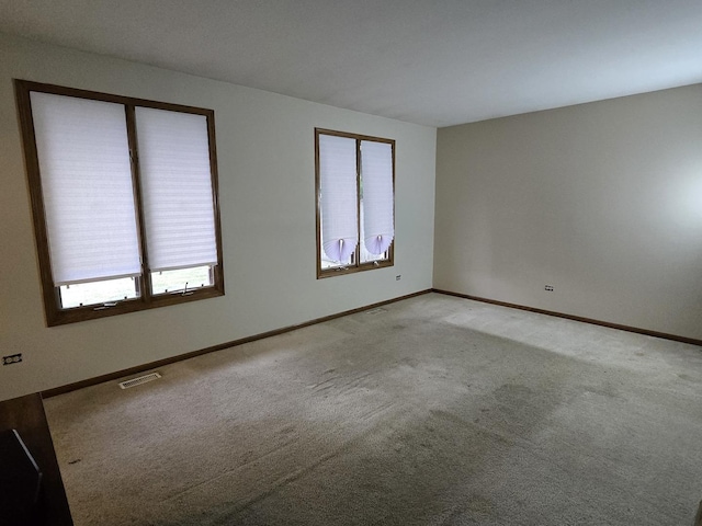 18510 Willow Ln, Lansing, IL 60438 - unfurnished room with light colored carpet and baseboards