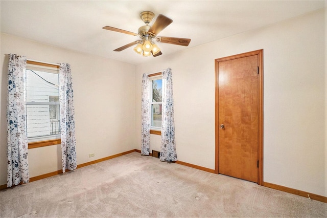 17958 Escanaba Ave, Lansing, IL 60438 - carpeted empty room with plenty of natural light and ceiling fan