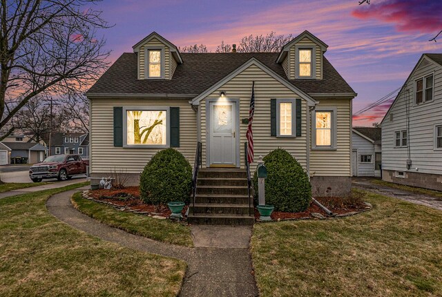 17958 Escanaba Ave, Lansing, IL 60438 - cape cod-style house featuring a yard, a shingled roof, and entry steps