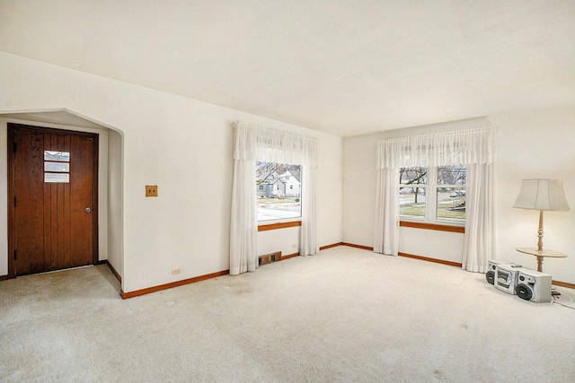 17958 Escanaba Ave, Lansing, IL 60438 - unfurnished living room with plenty of natural light and carpet floors