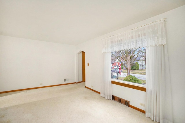 17958 Escanaba Ave, Lansing, IL 60438 - empty room featuring arched walkways and light carpet