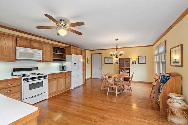 1642 Iowa Dr, Elk Grove Village, IL 60007 - kitchen with white appliances, open shelves, a chandelier, ornamental molding, and backsplash