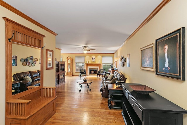 1642 Iowa Dr, Elk Grove Village, IL 60007 - living area with crown molding, ceiling fan, a warm lit fireplace, and light wood finished floors