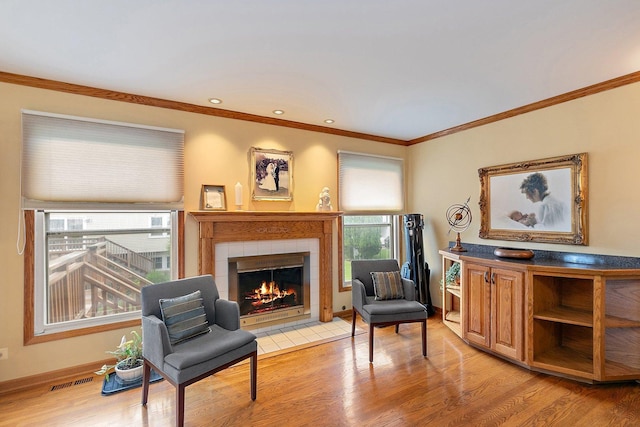 1642 Iowa Dr, Elk Grove Village, IL 60007 - sitting room featuring a fireplace, light wood-style flooring, and crown molding