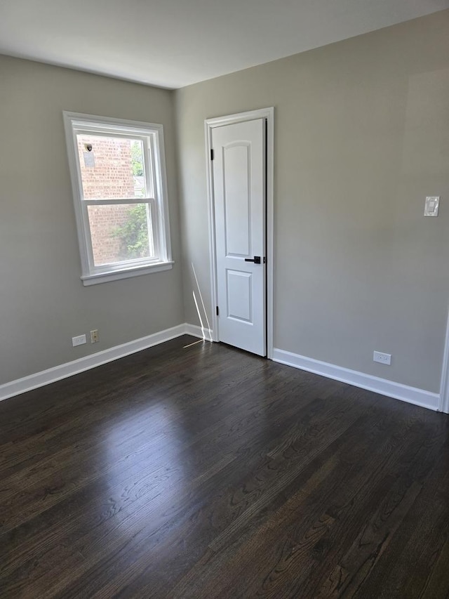 540 47th Ave, Bellwood, IL 60104 - empty room featuring dark wood-style floors and baseboards