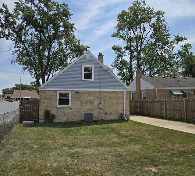 540 47th Ave, Bellwood, IL 60104 - view of property exterior with brick siding, a fenced backyard, a chimney, and a patio area