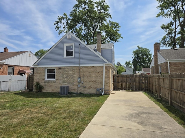 540 47th Ave, Bellwood, IL 60104 - view of side of home featuring brick siding and a central air condition unit