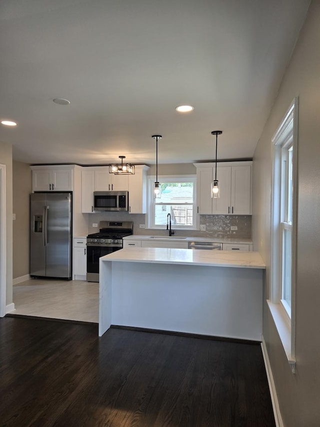 540 47th Ave, Bellwood, IL 60104 - kitchen featuring appliances with stainless steel finishes, light countertops, white cabinetry, and recessed lighting