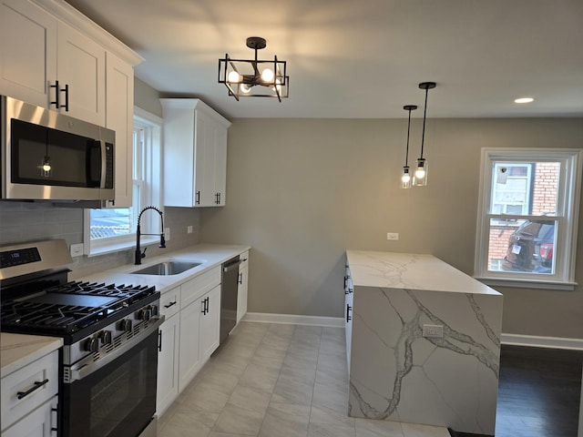 540 47th Ave, Bellwood, IL 60104 - kitchen featuring appliances with stainless steel finishes, tasteful backsplash, white cabinets, and recessed lighting