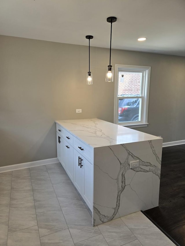 540 47th Ave, Bellwood, IL 60104 - kitchen featuring light stone countertops, white cabinetry, a peninsula, pendant lighting, and recessed lighting