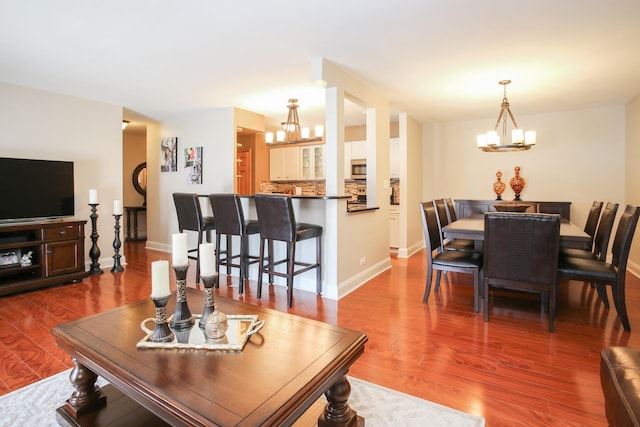 1415 E Central Rd Unit 219C, Arlington Heights, IL 60005 - living area featuring a chandelier and dark wood-style flooring