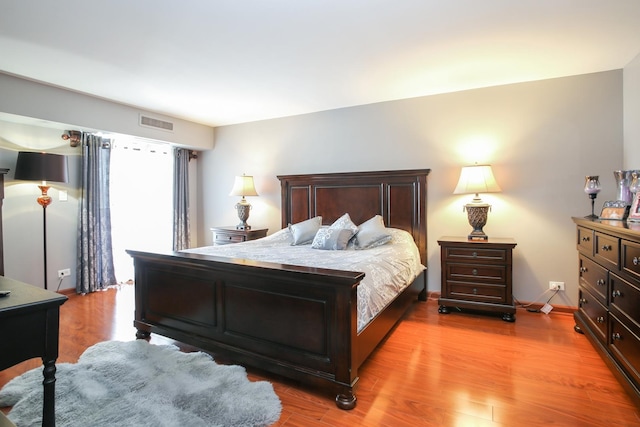 1415 E Central Rd Unit 219C, Arlington Heights, IL 60005 - bedroom featuring light wood-style flooring