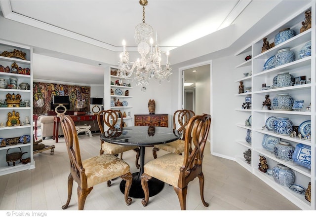 950 N Michigan Ave Unit 2901, Chicago, IL 60611 - dining space with a chandelier, light wood-style flooring, and crown molding