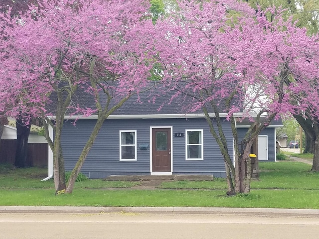711 S 3rd St, Oregon, IL 61061 - view of front facade featuring a front lawn and roof with shingles