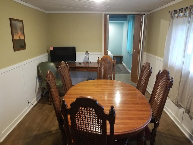 711 S 3rd St, Oregon, IL 61061 - dining area with crown molding, a wainscoted wall, and dark wood finished floors