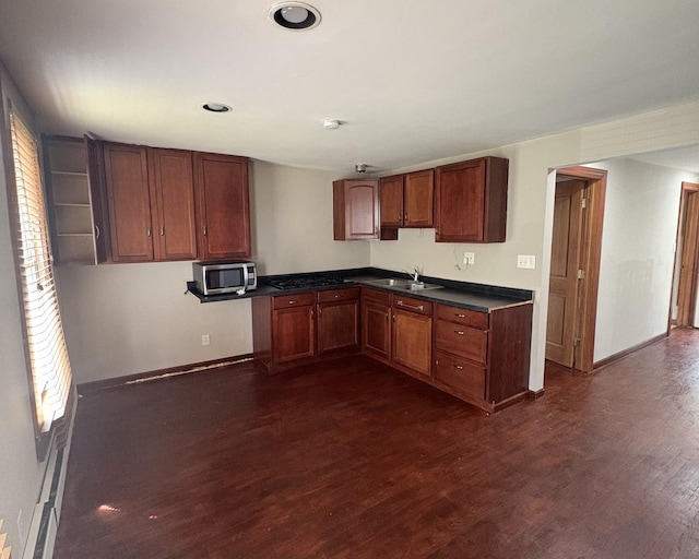17 S Cagwin Ave, Joliet, IL 60436 - kitchen featuring stainless steel microwave, dark wood-style floors, dark countertops, brown cabinetry, and recessed lighting