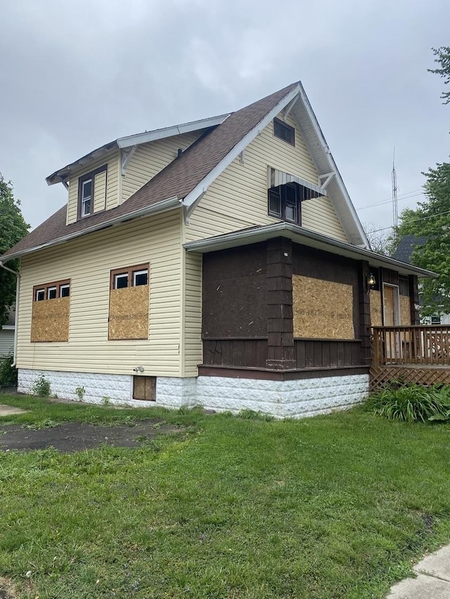 945 E Hickory St, Kankakee, IL 60901 - view of side of home with a yard, roof with shingles, and a wooden deck
