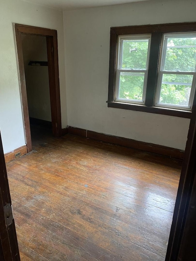 945 E Hickory St, Kankakee, IL 60901 - empty room with wood-type flooring and baseboards
