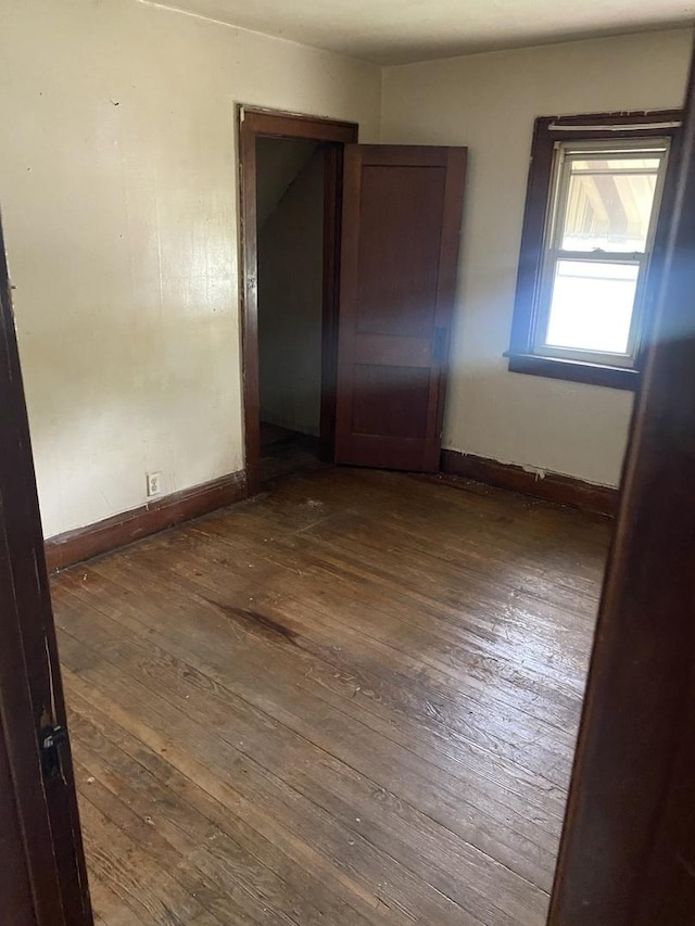 945 E Hickory St, Kankakee, IL 60901 - unfurnished room with wood-type flooring and baseboards