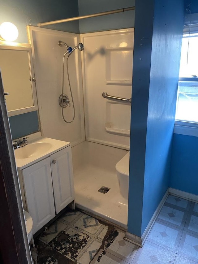 945 E Hickory St, Kankakee, IL 60901 - bathroom with a stall shower, tile patterned floors, and vanity