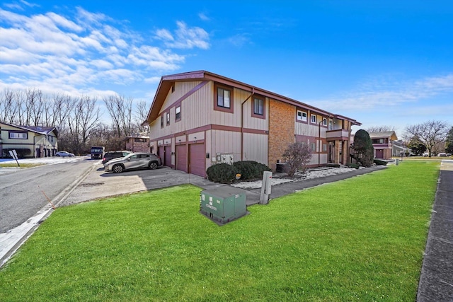 19400 Oak Ave Unit 1, Country Club Hills, IL 60478 - view of side of property featuring an attached garage, a lawn, and driveway