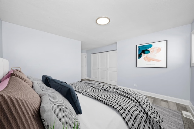 19400 Oak Ave Unit 1, Country Club Hills, IL 60478 - bedroom featuring wood finished floors and a closet