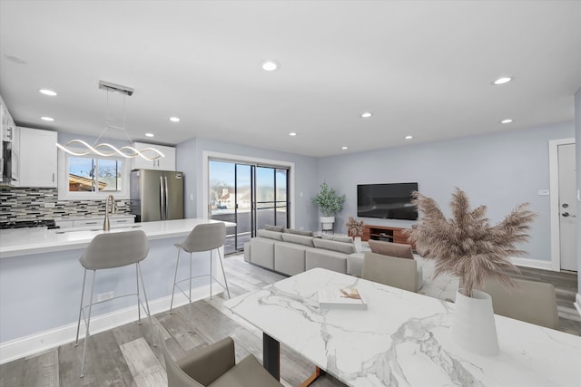 19400 Oak Ave Unit 1, Country Club Hills, IL 60478 - dining space with light wood-style floors, recessed lighting, and a chandelier