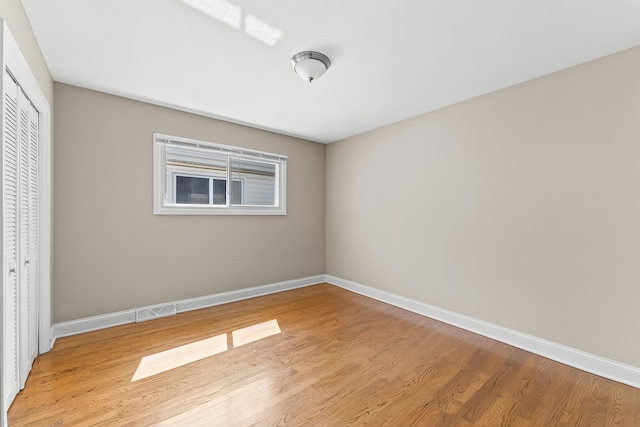 5008 Culver St, Skokie, IL 60077 - unfurnished bedroom featuring a closet and light wood finished floors
