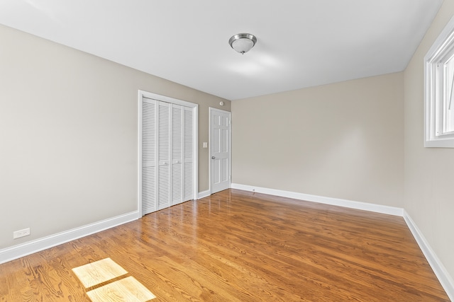 5008 Culver St, Skokie, IL 60077 - unfurnished bedroom with wood finished floors and a closet