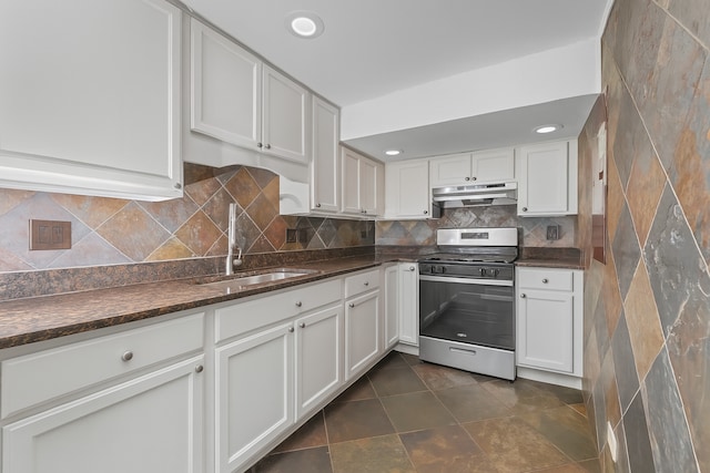 5008 Culver St, Skokie, IL 60077 - kitchen featuring stainless steel range with gas stovetop, under cabinet range hood, white cabinets, decorative backsplash, and recessed lighting