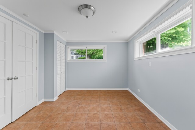 5008 Culver St, Skokie, IL 60077 - unfurnished bedroom featuring ornamental molding and light tile patterned flooring