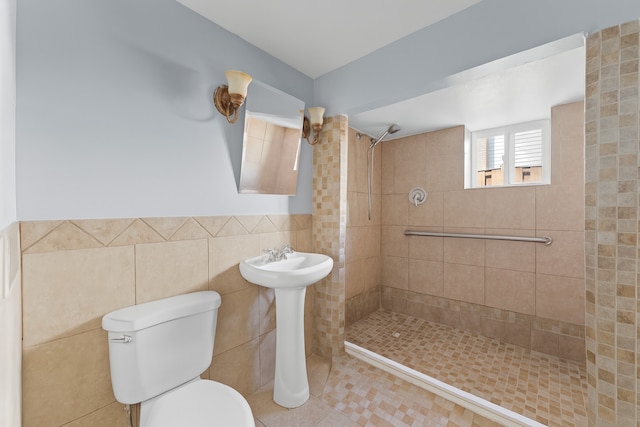 5008 Culver St, Skokie, IL 60077 - full bath featuring a tile shower, tile walls, tile patterned floors, and wainscoting